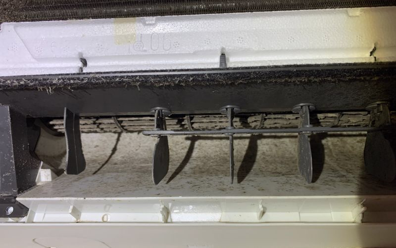 Dirty split system blower wheel and evaporator coil caked in dust and grime